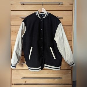 H&M varsity jacket size medium. Black with white faux leather sleeves